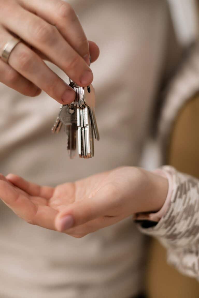 Hands exchanging house keys