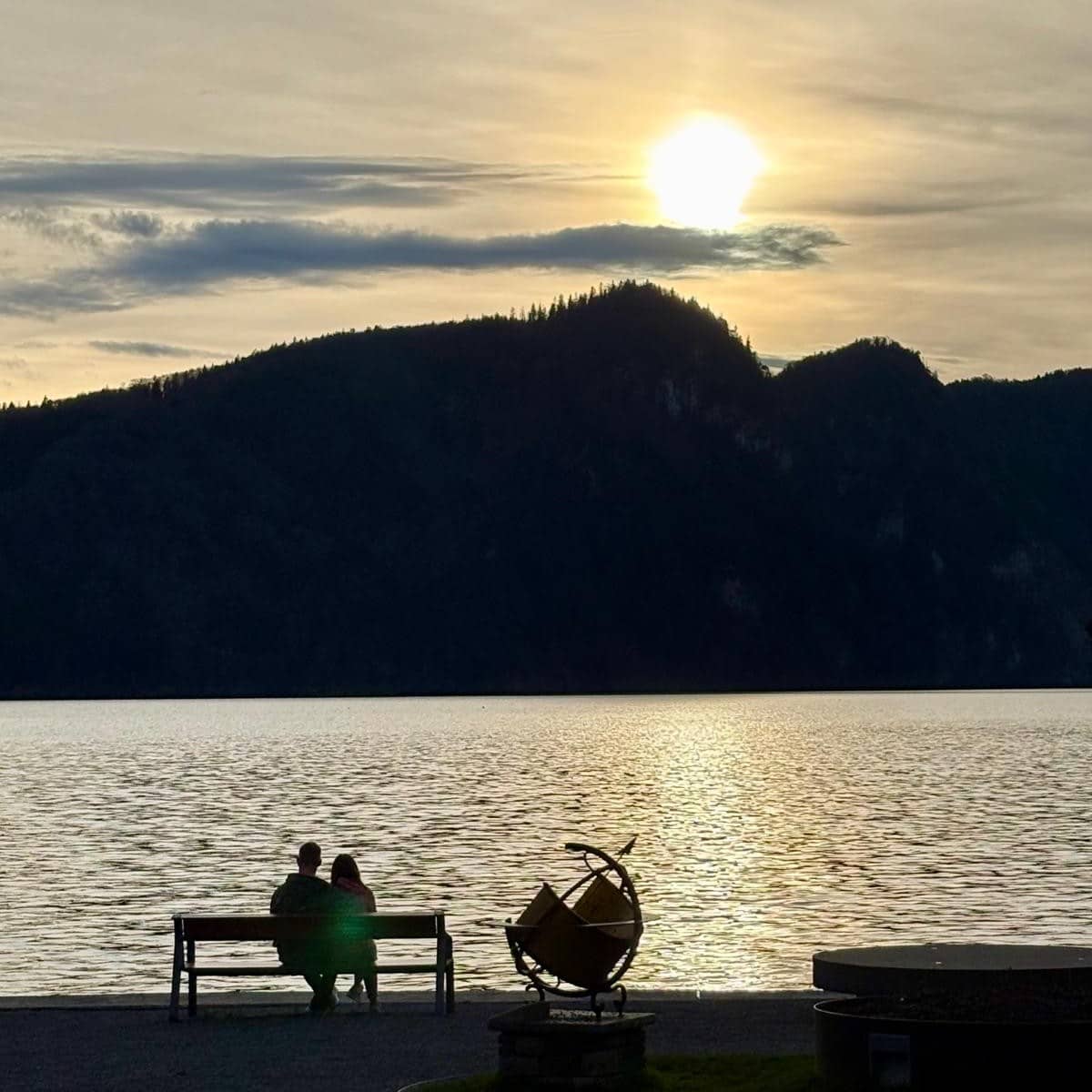 couple sitting near Lake Lucerne